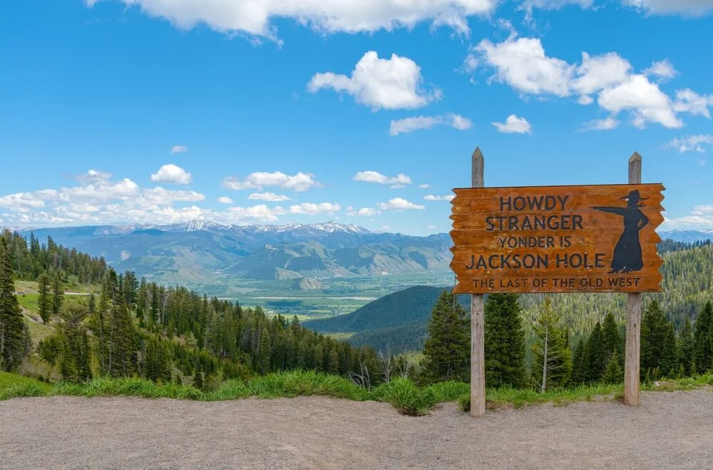 Howdy Stranger Yonder Is Jackson Hole sign overlooking the Jackson Hole valley